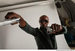 ERIC STANDING POSE WITH GUNS